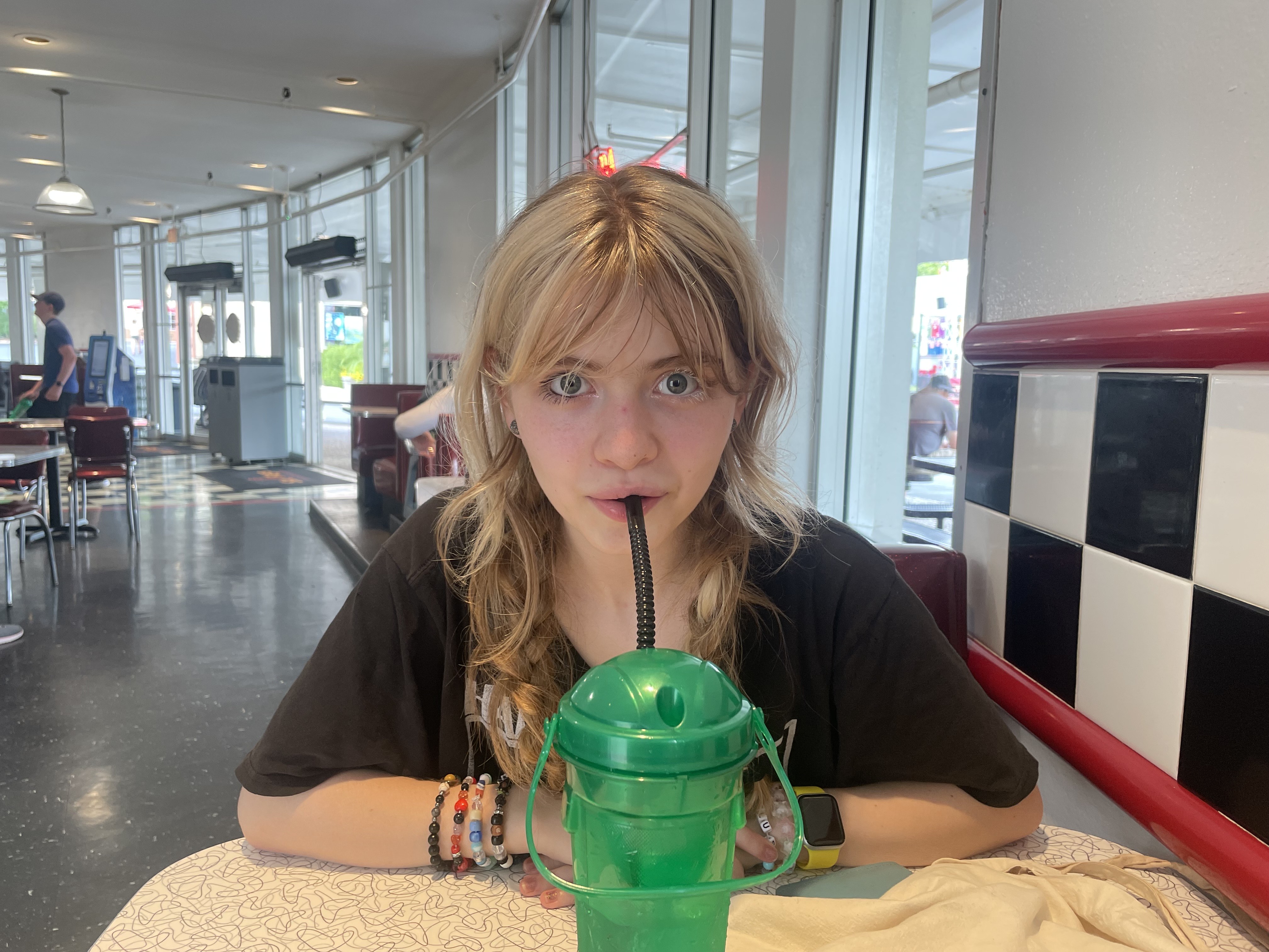 My friend, Paisley, drinking from my refilable cup.