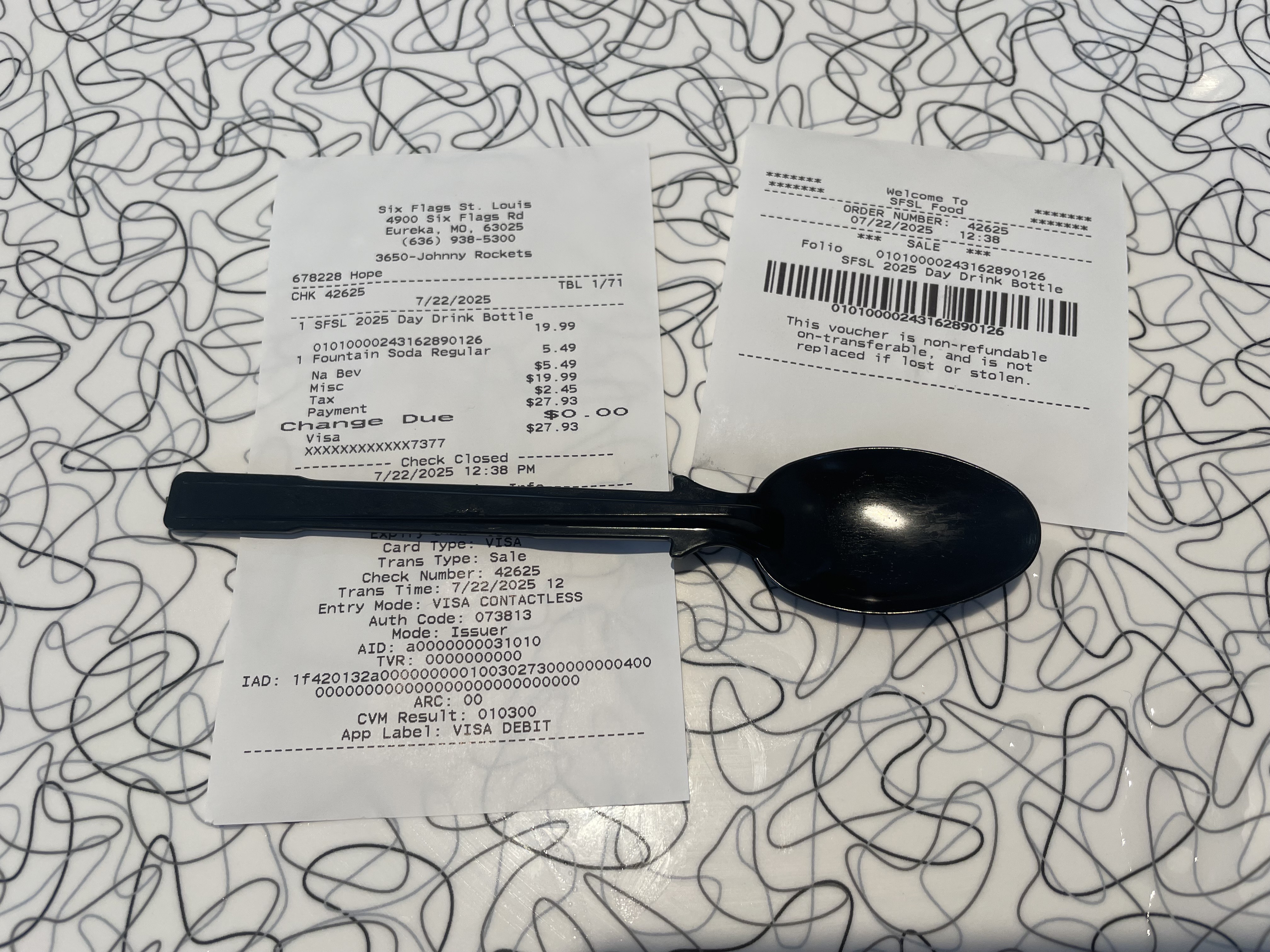 Receipt from Six Flags displaying a grand total of $27.93 for two drinks.