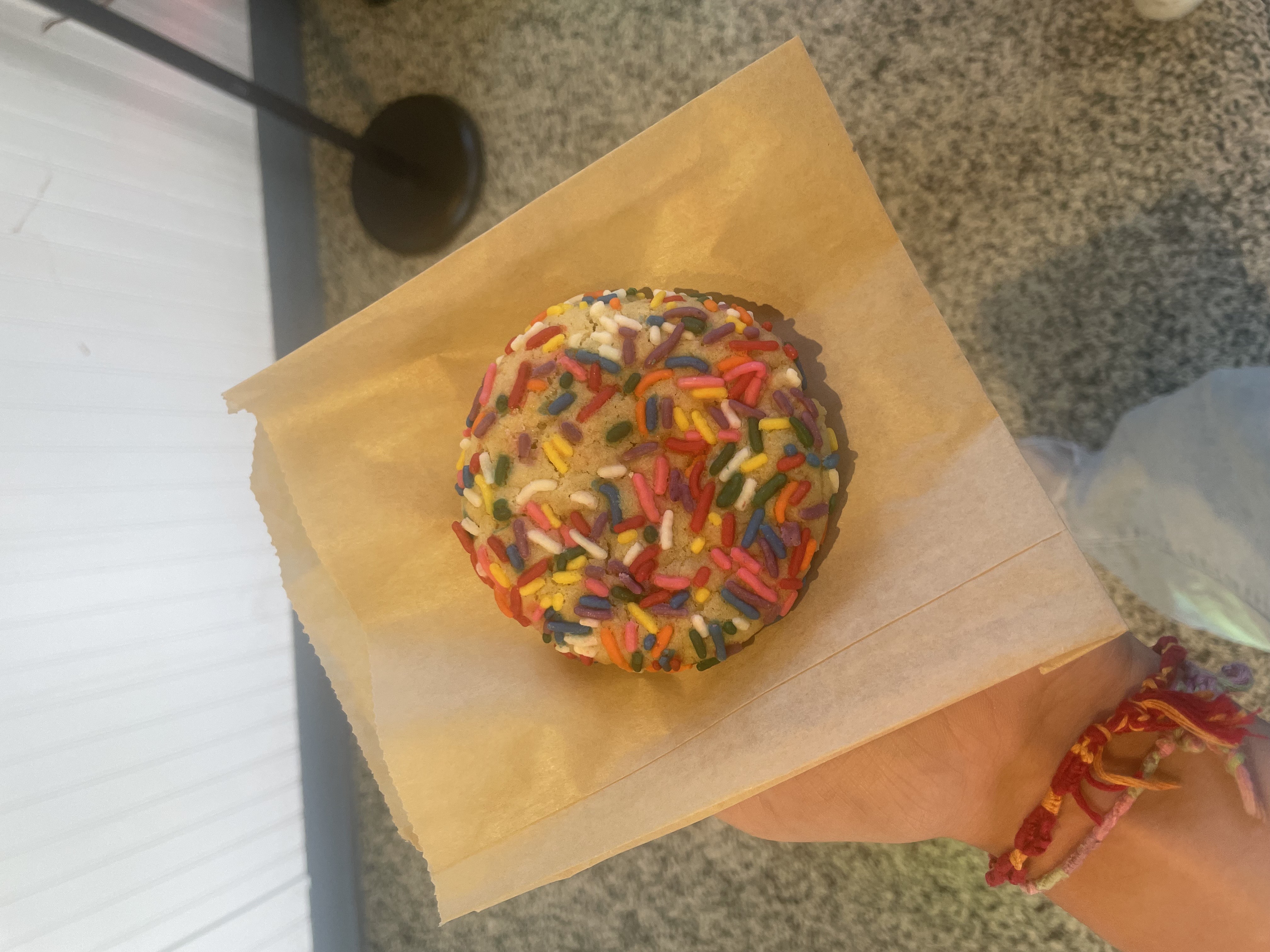 An image of a cookie with sprinkles